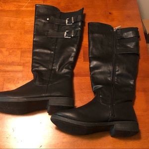 Black tall boots with buckles